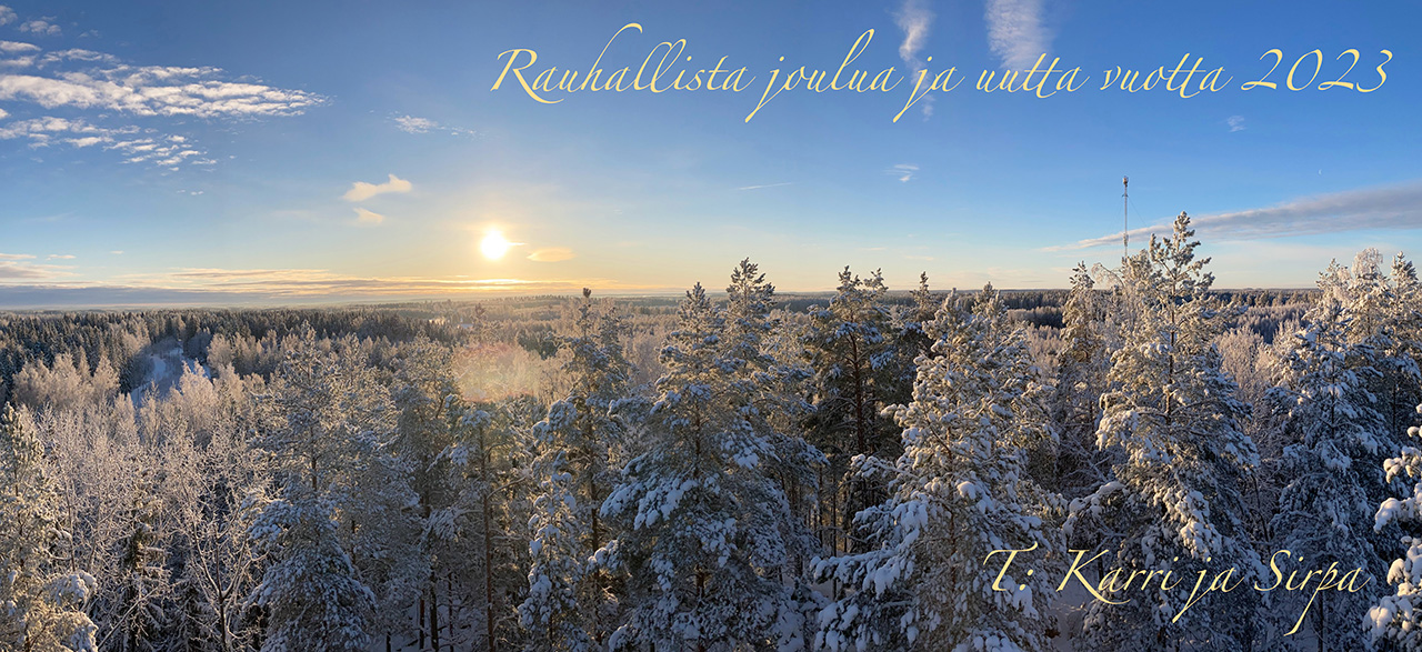 Blue sky and snow coated, frosted tree tops bathing in a winter sunshine from Mattila's birdtower in Lempäälä with the greeting Rauhallista joulua ja uutta vuotta 2023 from Karri and Sirpa. A full size photo available with a click.